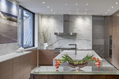 Mid-sized trendy u-shaped cement tile floor and gray floor eat-in kitchen photo in Chicago with an undermount sink, flat-panel cabinets, medium tone wood cabinets, marble countertops, white backsplash, marble backsplash, paneled appliances, an island and white countertops