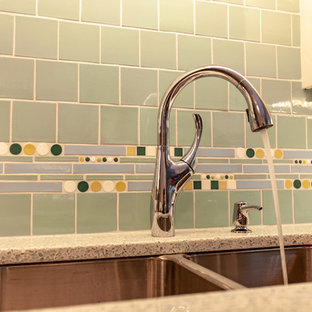 This is an example of a midcentury separate kitchen in Minneapolis with an undermount sink, shaker cabinets, white cabinets, recycled glass benchtops, green splashback, mosaic tile splashback, stainless steel appliances, medium hardwood floors, no island, brown floor and white benchtop.
