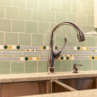Midcentury separate kitchen in Minneapolis with an undermount sink, shaker cabinets, white cabinets, recycled glass benchtops, green splashback, mosaic tile splashback, stainless steel appliances, medium hardwood floors, no island, brown floor and white benchtop.