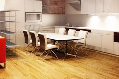Eat-in kitchen - l-shaped light wood floor eat-in kitchen idea in Baltimore with flat-panel cabinets and white cabinets