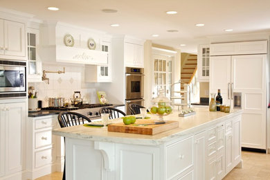 Transitional eat-in kitchen photo in Boston with beaded inset cabinets, yellow cabinets, granite countertops, white backsplash, ceramic backsplash, stainless steel appliances and an island