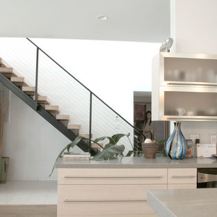 Large contemporary eat-in kitchen designs - Inspiration for a large contemporary u-shaped light wood floor eat-in kitchen remodel in Los Angeles with an undermount sink, flat-panel cabinets, light wood cabinets, quartz countertops, gray backsplash, porcelain backsplash, an island and stainless steel appliances