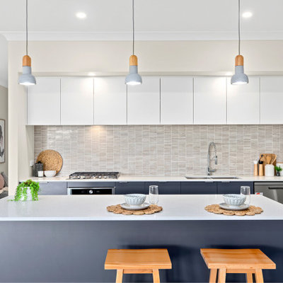 Kitchen - contemporary galley medium tone wood floor and brown floor kitchen idea in Other with an undermount sink, flat-panel cabinets, white cabinets, gray backsplash, mosaic tile backsplash, stainless steel appliances, an island and white countertops