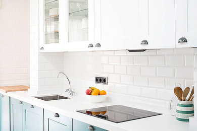 Inspiration for a medium sized urban single-wall enclosed kitchen in Madrid with wood worktops, white splashback, plywood flooring, a single-bowl sink, recessed-panel cabinets, green cabinets, metro tiled splashback and no island.