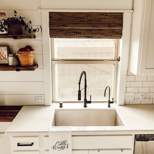 Inspiration for a country kitchen in Los Angeles with recessed-panel cabinets, white splashback and shiplap splashback.