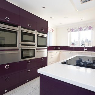 Design ideas for a large contemporary kitchen in Other with an integrated sink, flat-panel cabinets, quartzite benchtops, glass tile splashback, stainless steel appliances, vinyl floors and with island.