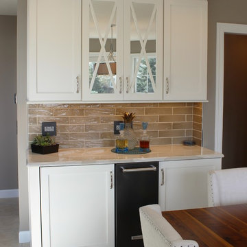 Quad Cities Kitchen With Gray Base Cabinets and Waterfall Counters