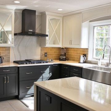 Quad Cities Kitchen With Gray Base Cabinets and Waterfall Counters