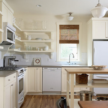 Quaint painted kitchen with open shelving