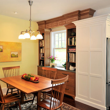 Quaint Victorian Kitchen with Dramatic Metal Range Hood