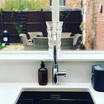 Quartz worktop, upstand and cill, undermount sink and Quooker tap.