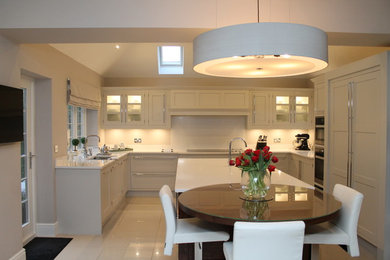 This is an example of a large contemporary l-shaped kitchen/diner in Other with an island.