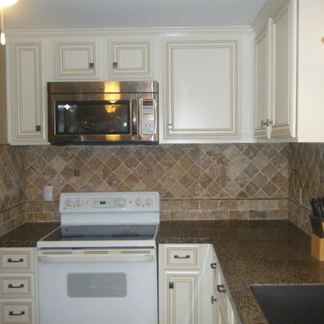 Raising the cabinets and adding crown molding gave the kitchen a more elegant an