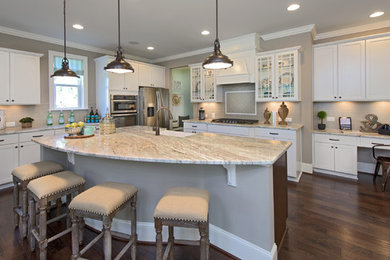 Example of a classic medium tone wood floor kitchen design in Raleigh with white cabinets, beige backsplash, subway tile backsplash, stainless steel appliances and an island