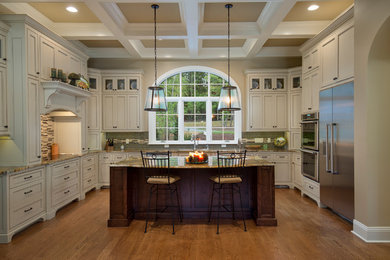 Example of a huge classic u-shaped medium tone wood floor and orange floor eat-in kitchen design in Other with an undermount sink, white cabinets, green backsplash, stainless steel appliances, an island, shaker cabinets, granite countertops, ceramic backsplash and brown countertops