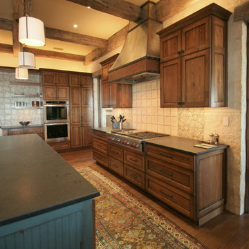 Ranch house kitchen with stained cabinets and glazed island
