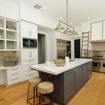Example of a trendy kitchen design in Los Angeles with stainless steel appliances and subway tile backsplash