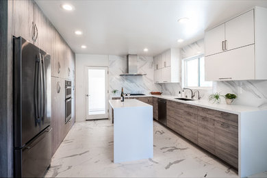 Inspiration for a large contemporary l-shaped porcelain tile and white floor eat-in kitchen remodel in Los Angeles with an undermount sink, flat-panel cabinets, quartz countertops, white backsplash, marble backsplash, stainless steel appliances, an island, white countertops and white cabinets
