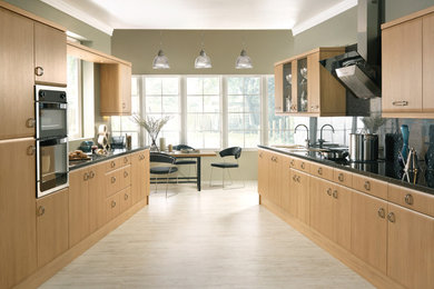 Photo of a contemporary kitchen/diner in Other with granite worktops, integrated appliances, lino flooring and no island.