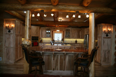 Kitchen - rustic kitchen idea in Other with flat-panel cabinets, light wood cabinets, granite countertops and two islands