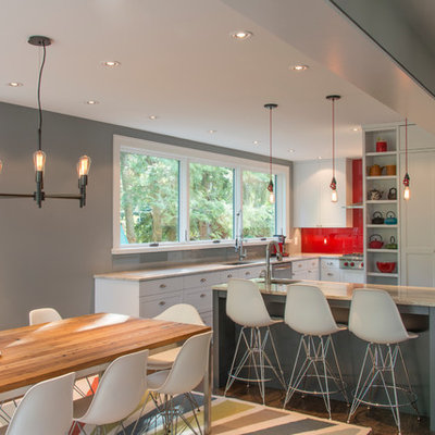 Eat-in kitchen - contemporary dark wood floor eat-in kitchen idea in DC Metro with an undermount sink, glass sheet backsplash, stainless steel appliances, an island, shaker cabinets, white cabinets and red backsplash