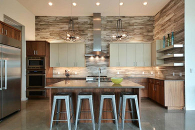 Large trendy u-shaped concrete floor and gray floor kitchen photo in New York with an undermount sink, brown backsplash, porcelain backsplash, stainless steel appliances, flat-panel cabinets, dark wood cabinets and an island