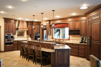 Example of a large arts and crafts u-shaped eat-in kitchen design in Calgary with marble countertops, stainless steel appliances and an island
