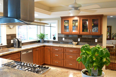 Mid-sized transitional u-shaped eat-in kitchen photo in San Diego with medium tone wood cabinets, granite countertops, blue backsplash and no island