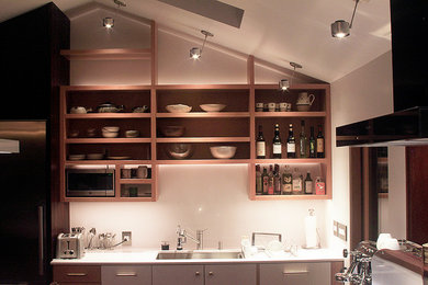 Example of a small 1950s l-shaped open concept kitchen design in San Francisco with an undermount sink, open cabinets, light wood cabinets, quartz countertops, stainless steel appliances and an island