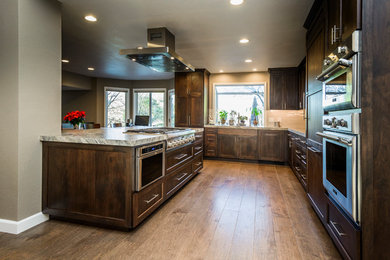 Inspiration for a mid-sized contemporary l-shaped medium tone wood floor kitchen remodel in San Francisco with an undermount sink, shaker cabinets, dark wood cabinets, quartzite countertops, gray backsplash, subway tile backsplash, stainless steel appliances and an island