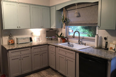 Inspiration for a coastal kitchen remodel in Detroit with gray cabinets, granite countertops, white backsplash, subway tile backsplash and gray countertops