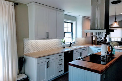 Example of a mid-sized transitional galley open concept kitchen design in St Louis with shaker cabinets, white cabinets and an island
