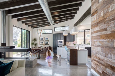 Eat-in kitchen - industrial eat-in kitchen idea in San Diego with an island