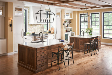 Mountain style brown floor kitchen photo in Chicago with dark wood cabinets, two islands and white countertops