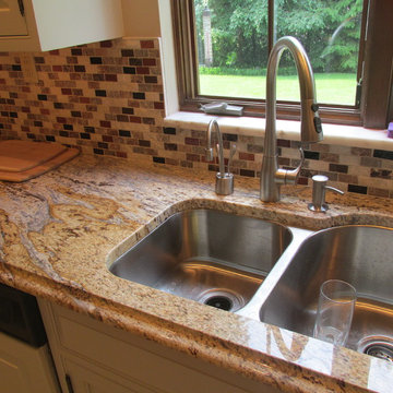 Refinished cabients with new Granite tops  and tile backsplash