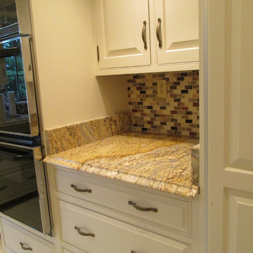 Refinished cabients with new Granite tops  and tile backsplash