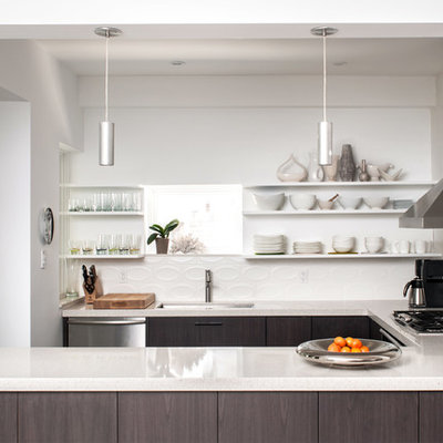 Example of a transitional u-shaped kitchen design in Toronto with an undermount sink, flat-panel cabinets, gray cabinets, white backsplash, stainless steel appliances and quartz countertops