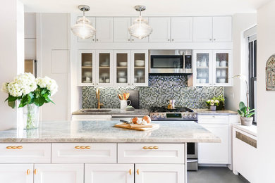 Example of a small transitional galley porcelain tile and gray floor open concept kitchen design in New York with an undermount sink, white cabinets, quartzite countertops, blue backsplash, glass tile backsplash, stainless steel appliances, an island and shaker cabinets