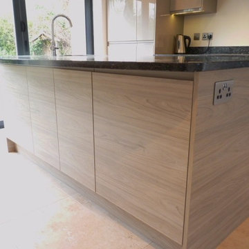 Remo Stone gloss & Elm effect handleless kitchen with Blue Pearl granite workto