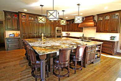 Inspiration for a huge timeless kitchen remodel in Kansas City with granite countertops and an island