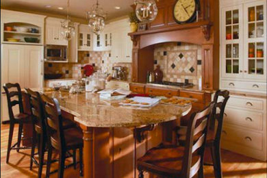 Example of a mid-sized transitional light wood floor enclosed kitchen design in Other with recessed-panel cabinets, white cabinets, ceramic backsplash, stainless steel appliances and an island