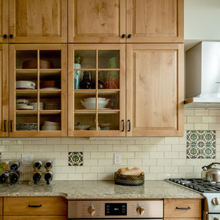 Mid-sized traditional eat-in kitchen designs - Example of a mid-sized classic u-shaped light wood floor and beige floor eat-in kitchen design in Boston with an undermount sink, raised-panel cabinets, light wood cabinets, granite countertops, white backsplash, subway tile backsplash, stainless steel appliances and an island