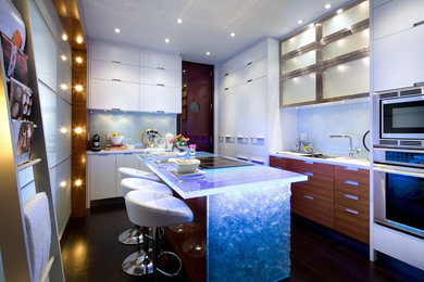 Kitchen - modern kitchen idea in Toronto with glass countertops