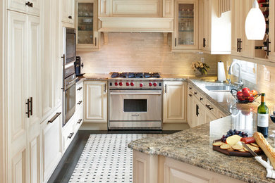 Mid-sized elegant kitchen photo in Toronto with raised-panel cabinets, beige cabinets, granite countertops, beige backsplash, porcelain backsplash and stainless steel appliances