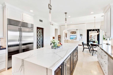 Inspiration for a timeless eat-in kitchen remodel in Los Angeles with quartz countertops and an island