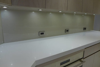 Example of a large transitional u-shaped open concept kitchen design in Miami with glass sheet backsplash and no island