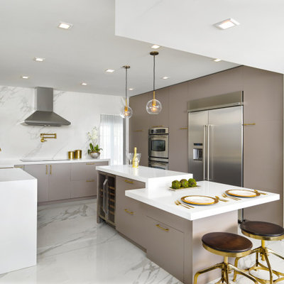 Inspiration for a large contemporary u-shaped marble floor and white floor eat-in kitchen remodel in Miami with an undermount sink, flat-panel cabinets, brown cabinets, marble countertops, white backsplash, marble backsplash, stainless steel appliances, an island and white countertops