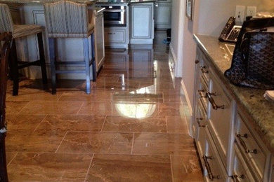 Example of a classic marble floor kitchen design in Houston