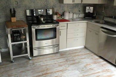 Inspiration for a rustic kitchen in Bridgeport with vinyl flooring.