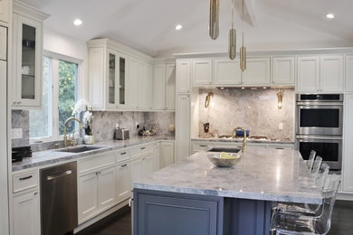 Mid-sized transitional l-shaped dark wood floor kitchen photo in Los Angeles with an undermount sink, beaded inset cabinets, white cabinets, marble countertops, marble backsplash, stainless steel appliances and an island